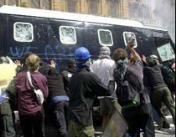 Protesters fight oppression, overturn a van